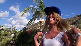 A hot blonde that loves exposing herself is making love outdoors