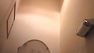 Japanese bimbos taking a piss in the toilet on hidden camera