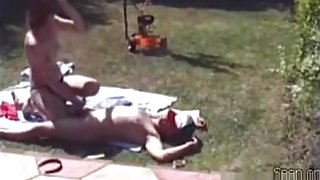 Voyeur tapes the neighbor getting sucked and jerked in his garden