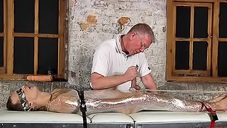 Handjob for bound boy in plastic wrap