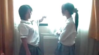 Amateur Asian schoolgirls kiss tits in hotel room