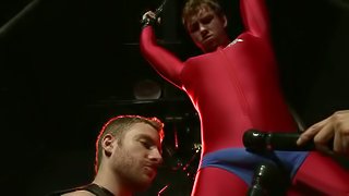 Connor Maguire enjoys a handjob while being tied up in gay BDSM scene