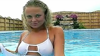 Bikini girl goes topless in pool