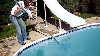 Cute black-haired babe rescuing a frog out of the pool