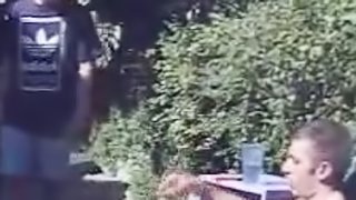A homemade video with two gays fucking in a backyard